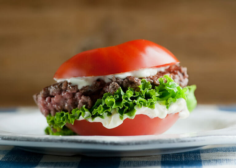 Tomato Bun Burger on a plate.