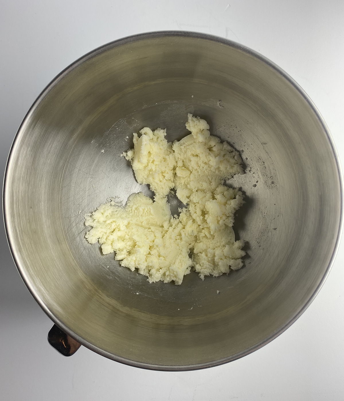 Butter and sugar in a mixing bowl.