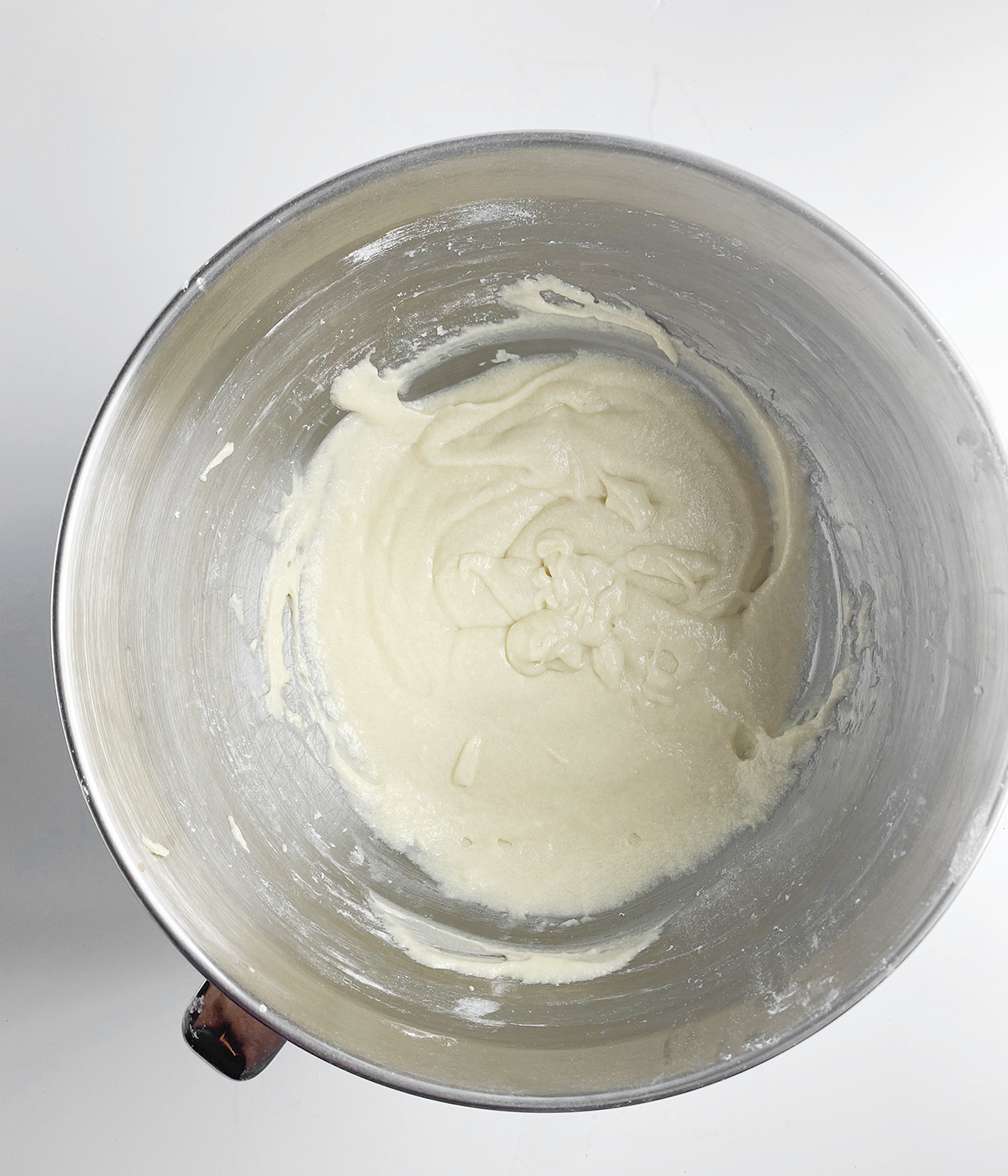 Cinnamon roll batter in a mixing bowl.