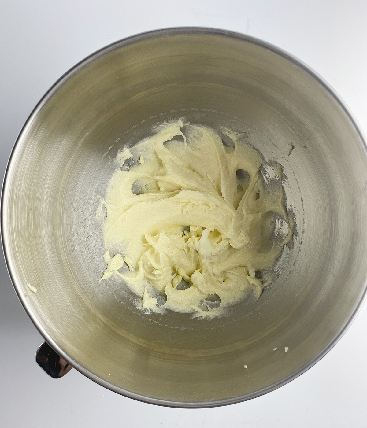 Creamed butter in a mixing bowl.