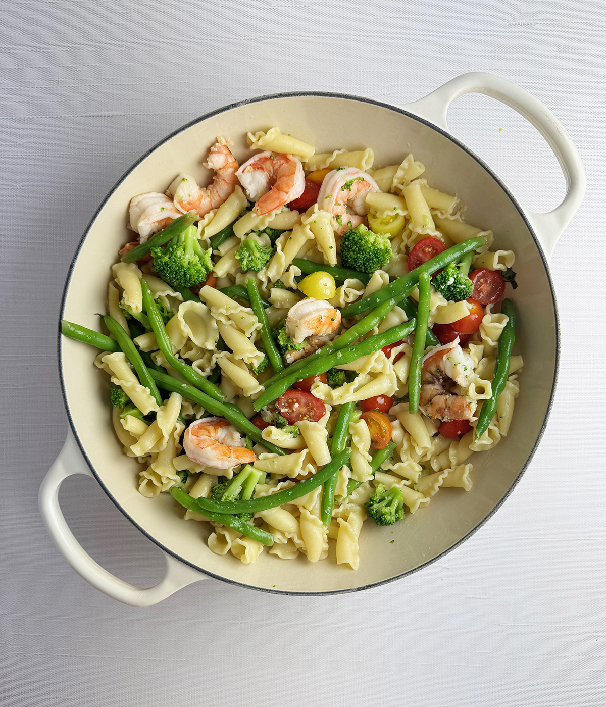 Shrimp pasta primavera in a pan.