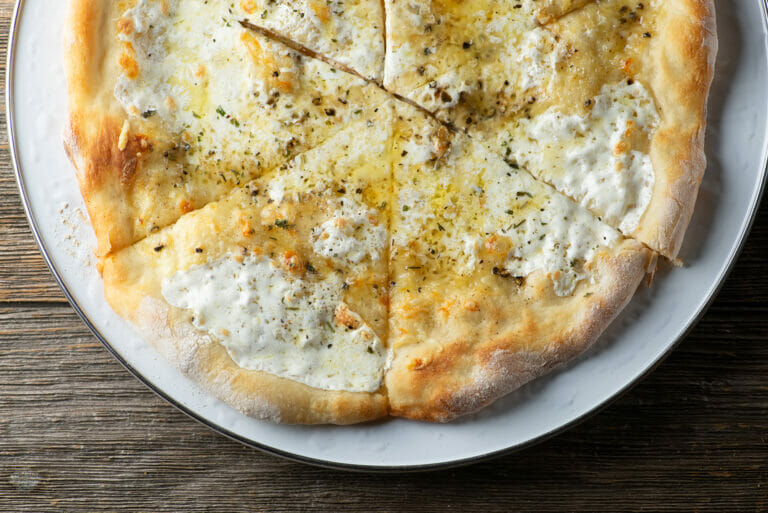 Honey Cheese Pizza on a plate.