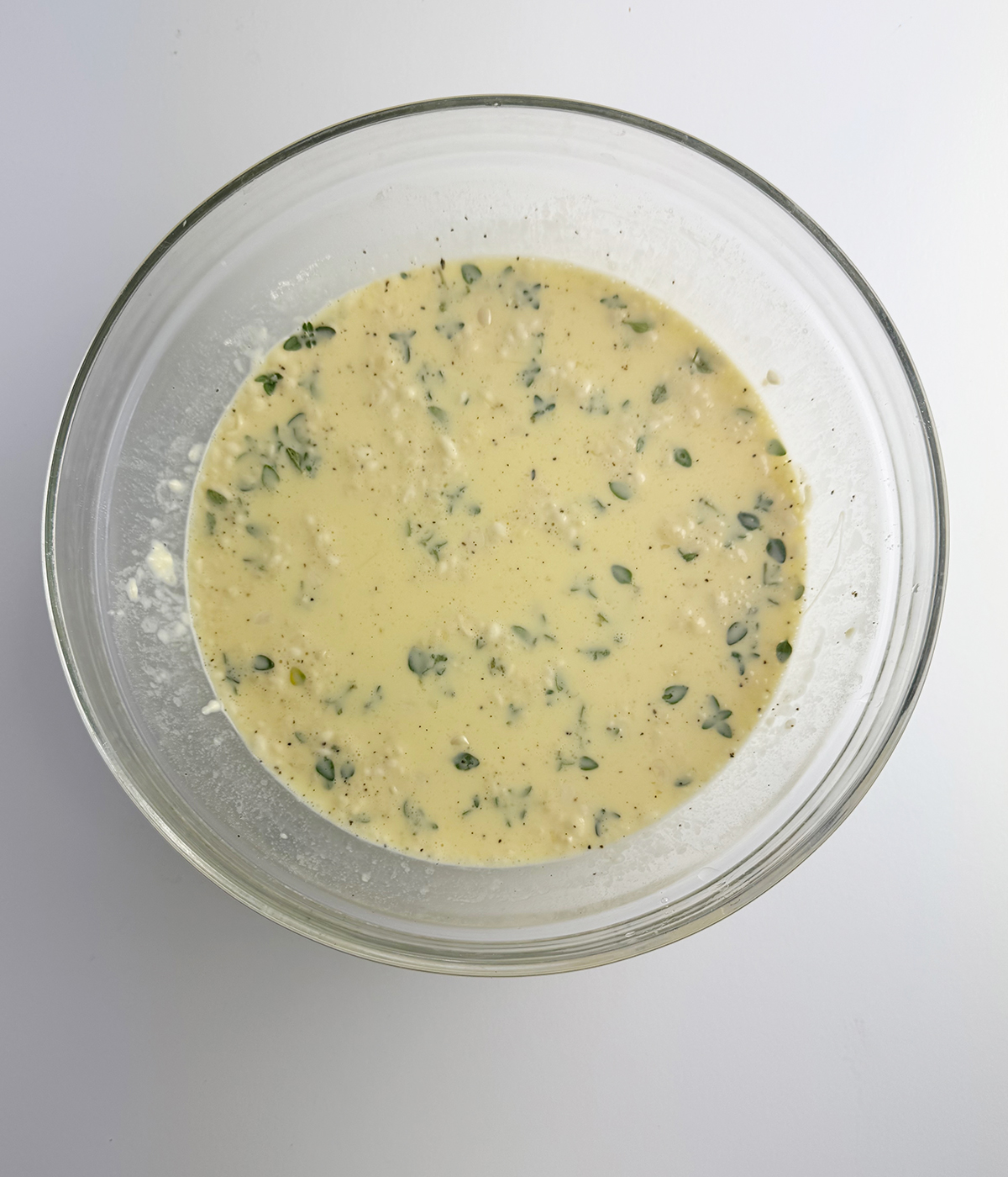 Corn honey quiche mixture in a mixing bowl.