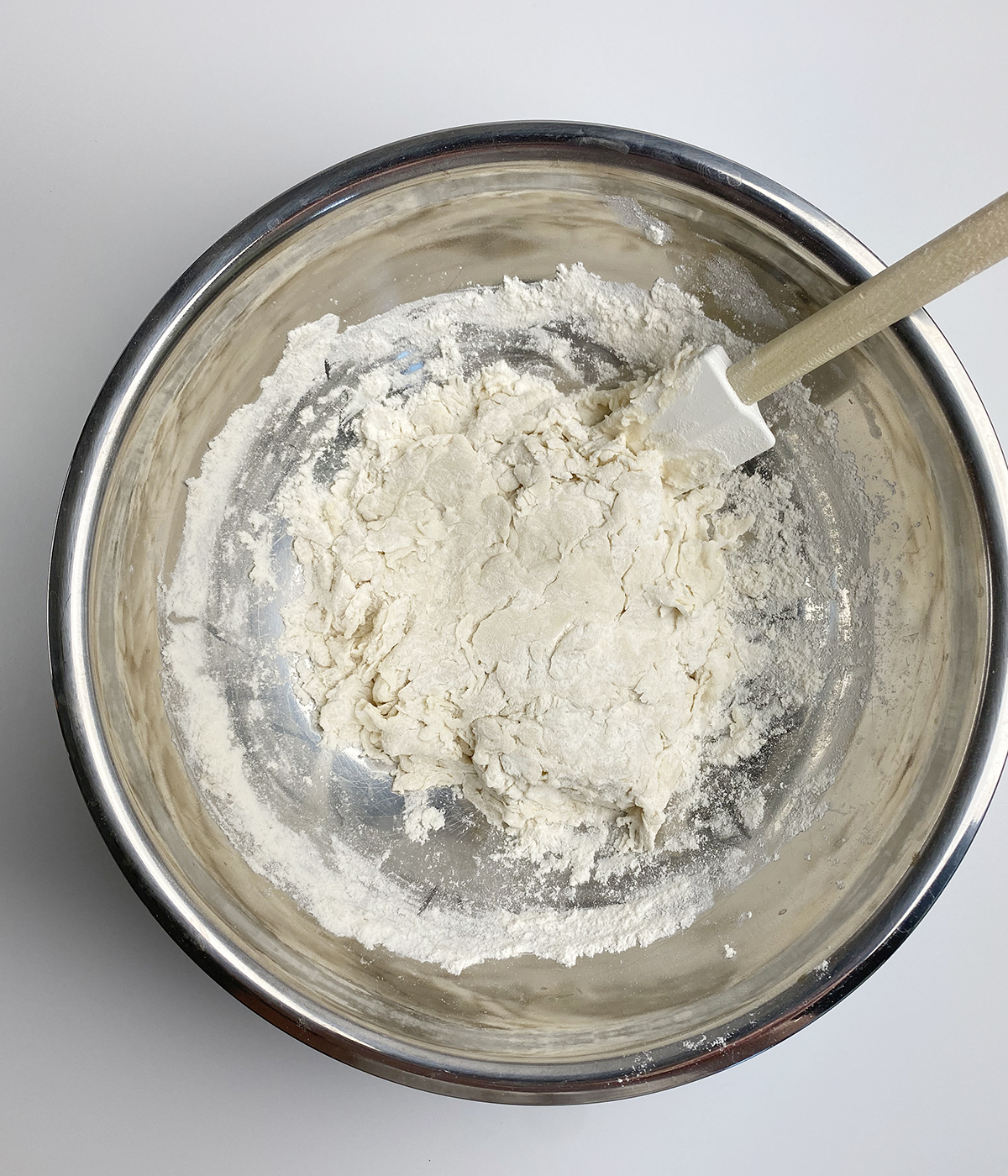 Flatbread dough mixing up in a bowl.