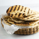 Grilled flatbread in a basket.