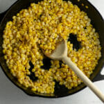 Cooked skillet corn in a cast iron skillet.