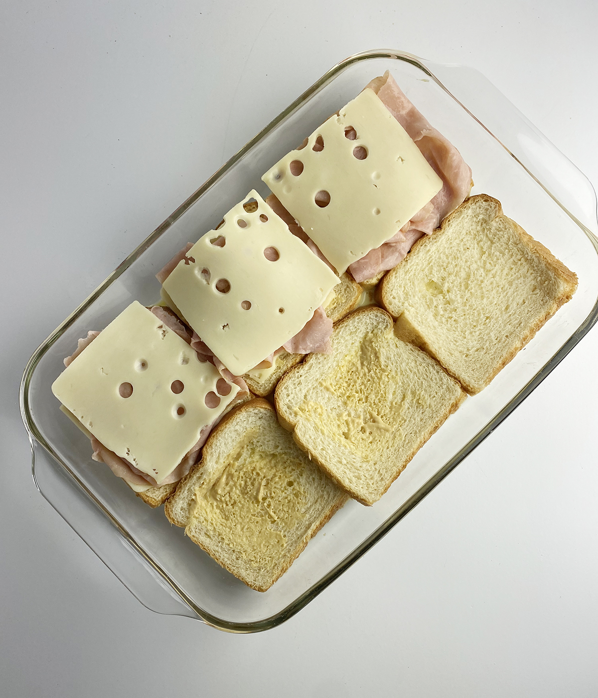 French toast grilled cheese sandwiches being assembled.