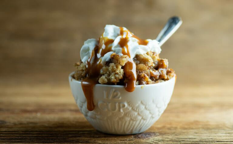 Skillet apple crisp in a bowl.