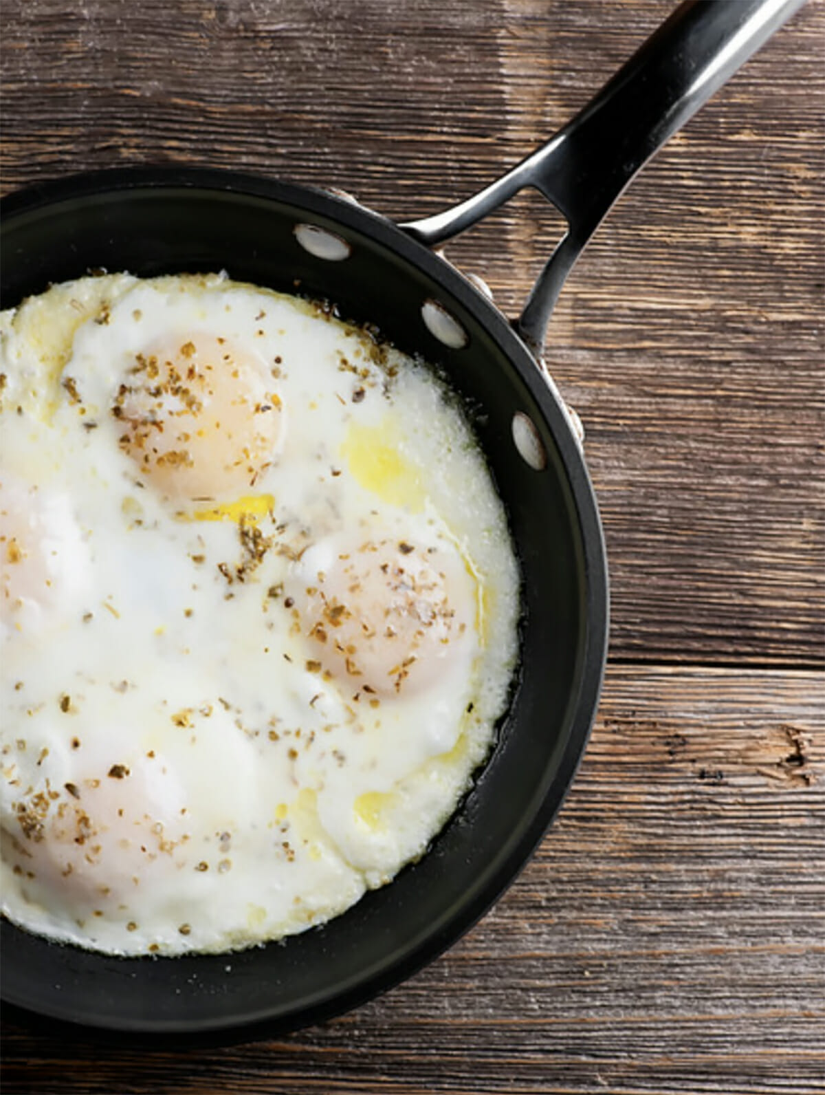 Fried eggs in a frying pan.