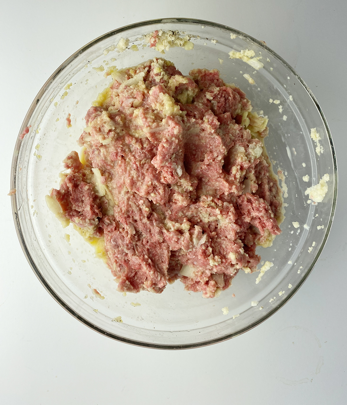 Brown sugar meatloaf mixture in a mixing bowl.