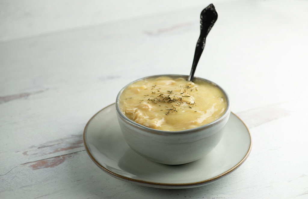 Chicken cauliflower soup in a bowl.