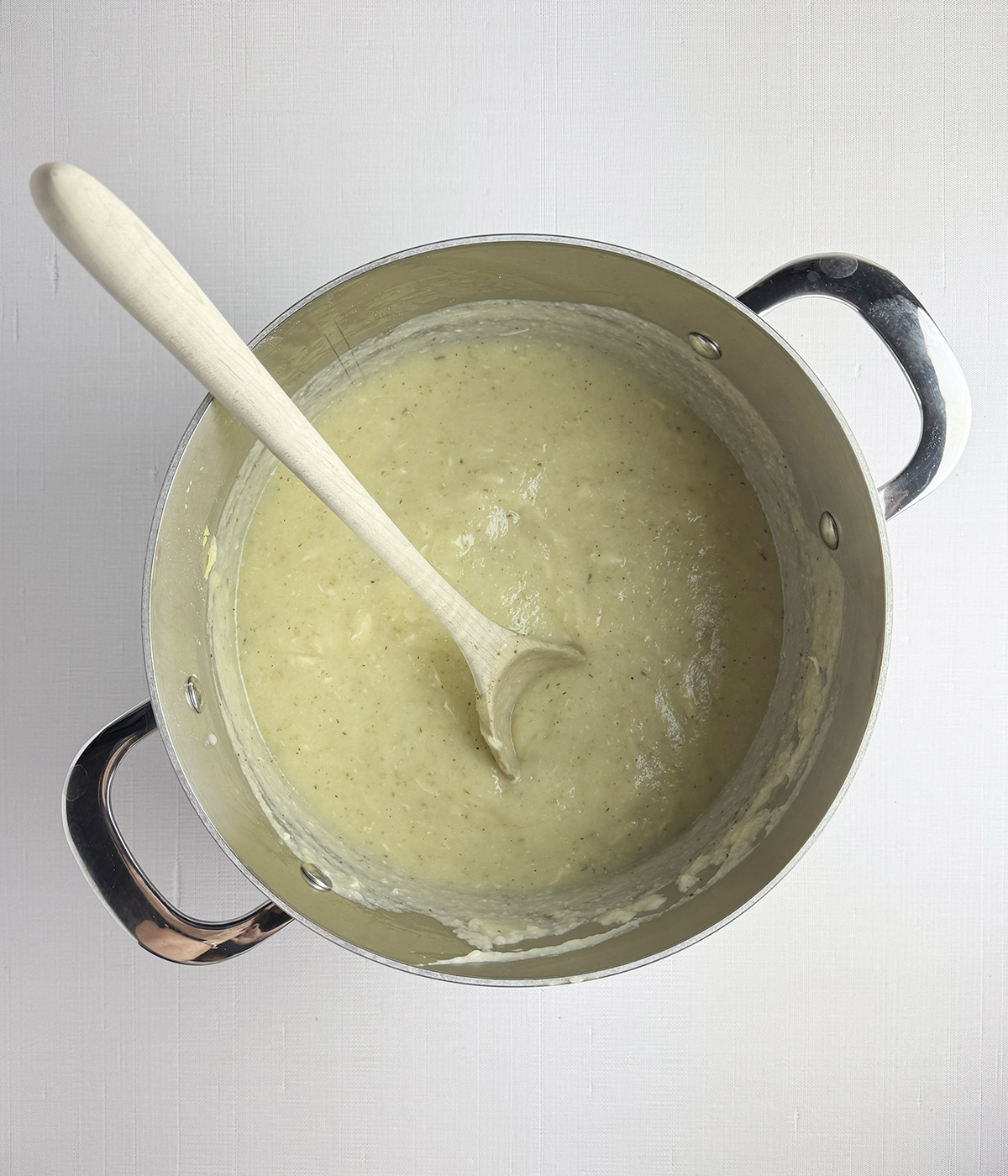 Chicken cauliflower soup in a pot.