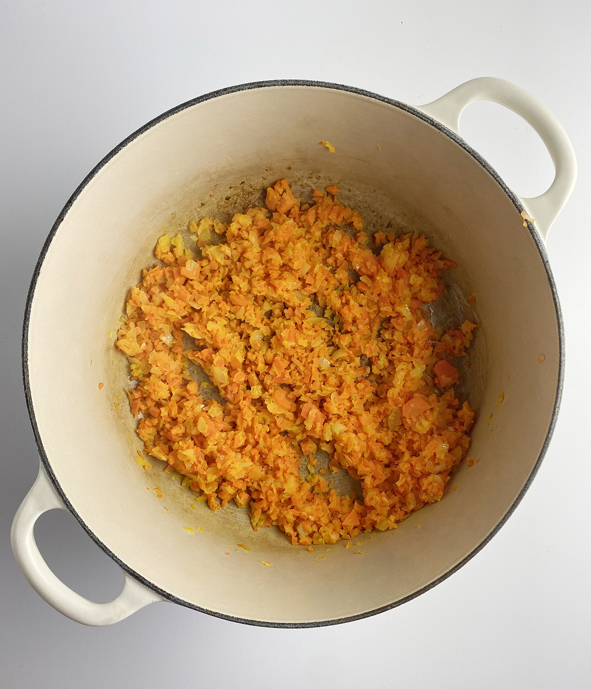 Cooked chopped vegetables in a pot.