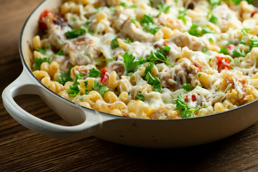 Creamy Chicken Parmesan Pasta in a skillet.