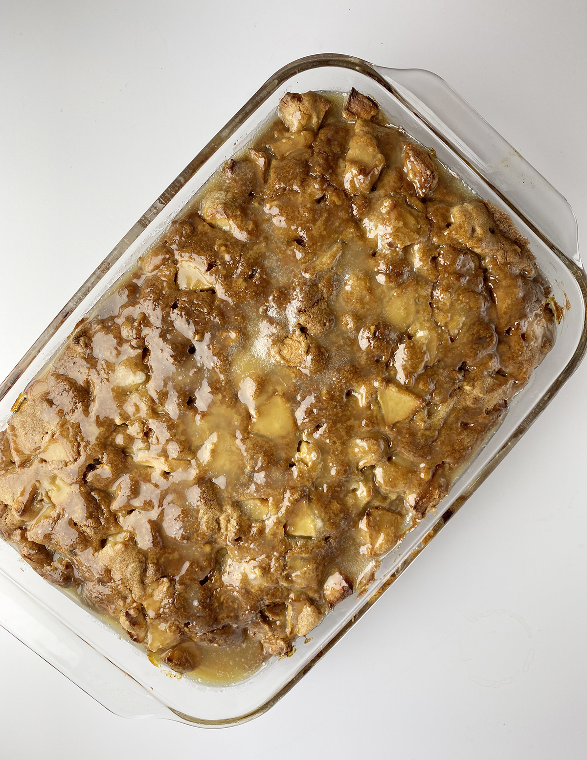 Caramel apple cake with glaze poured over the top.