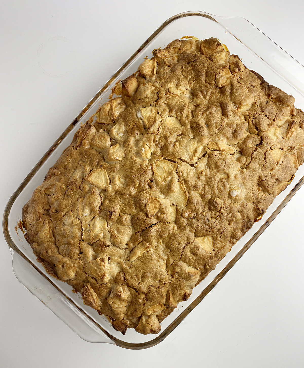 Baked apple cake in a casserole dish.