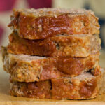 Brown sugar meatloaf slices in a stack.