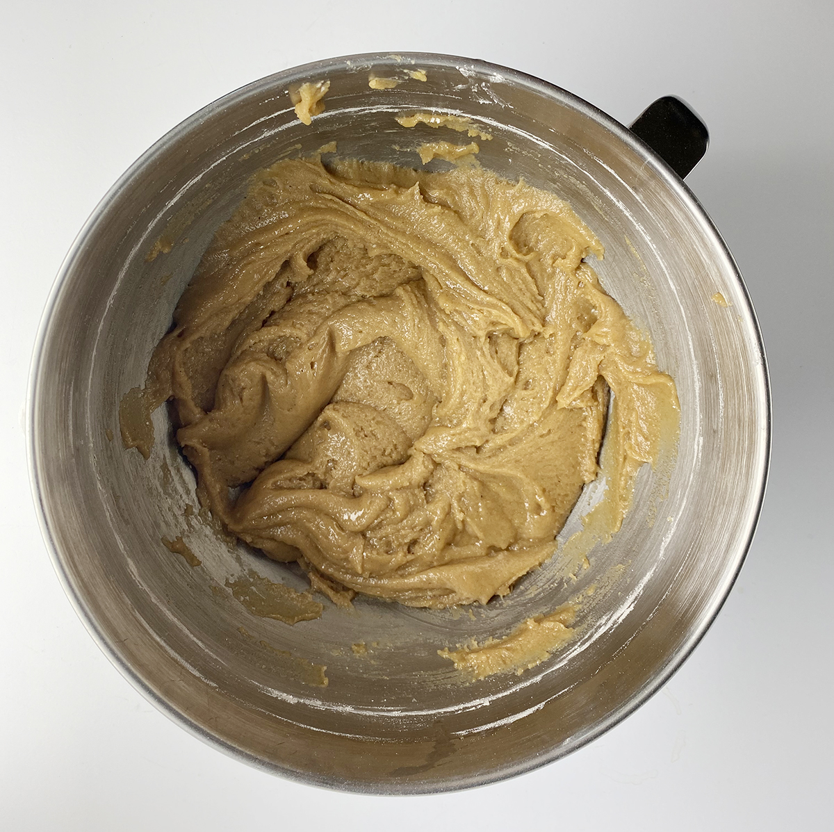 Caramel apple cake batter in a mixing bowl.