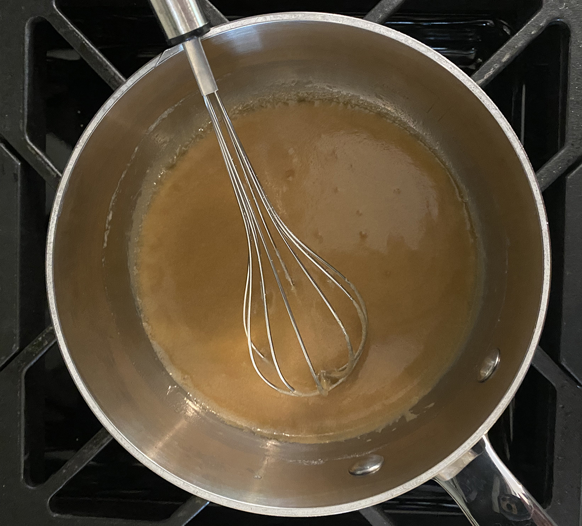 Caramel glaze in a pot.