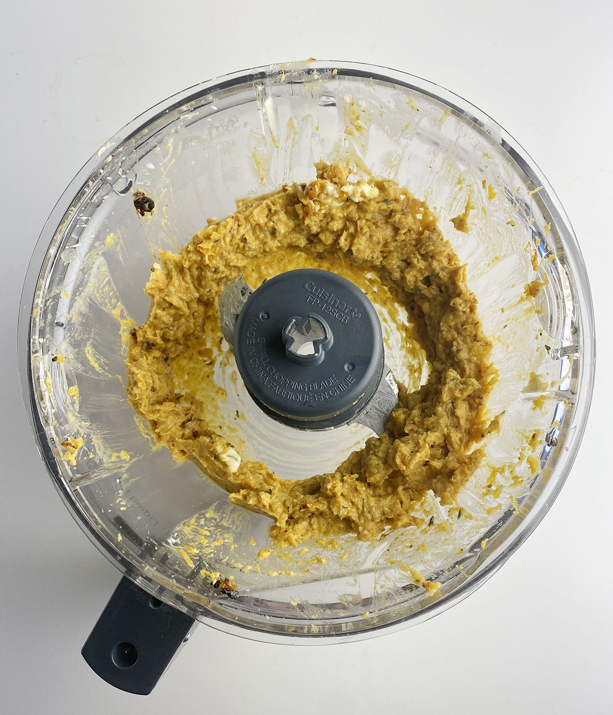 Mashed honey and butternut squash in a food processor.