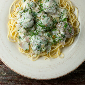 Beef Stroganoff Spaghetti and Meatballs on a plate.