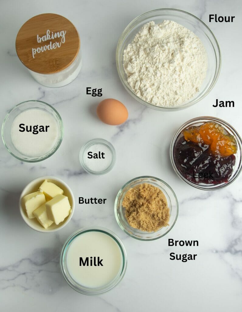 Jam Cake ingredients on a marble counter.