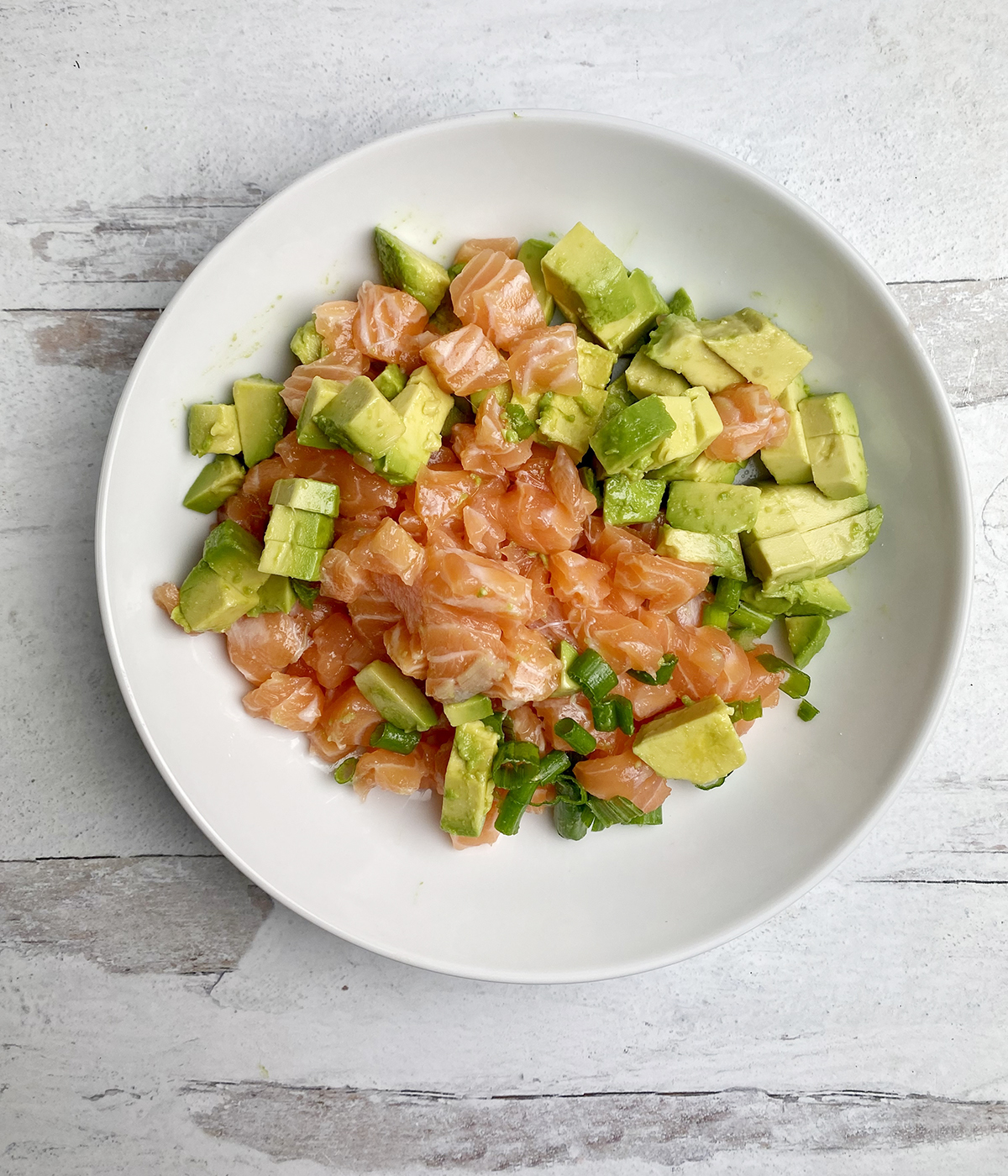 Salmon tartare mixture in a bowl.