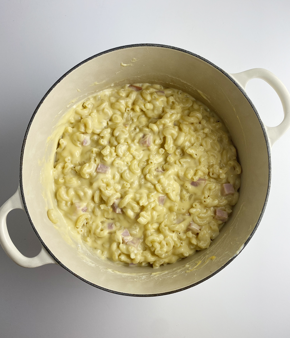 Ham macaroni and cheese in a pot.