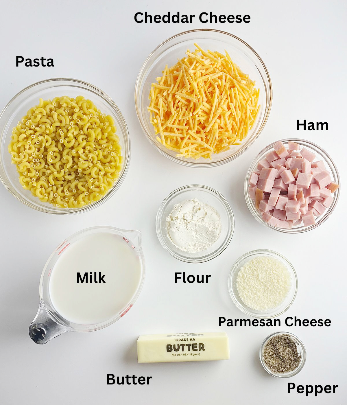 Ingredients needed to make ham macaroni and cheese.