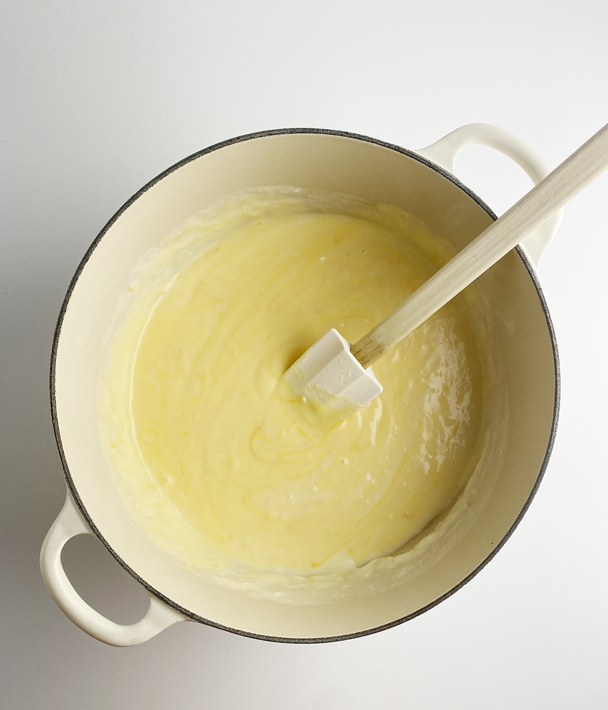 Melted cheese sauce in a pot.