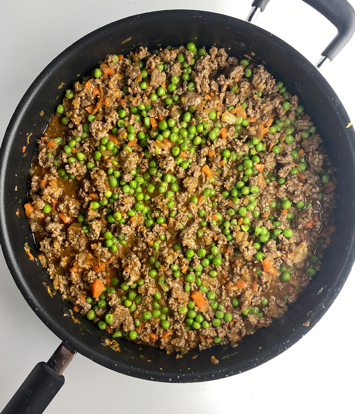 Skillet shepherd's pie meat and vegetable filling in a pan.