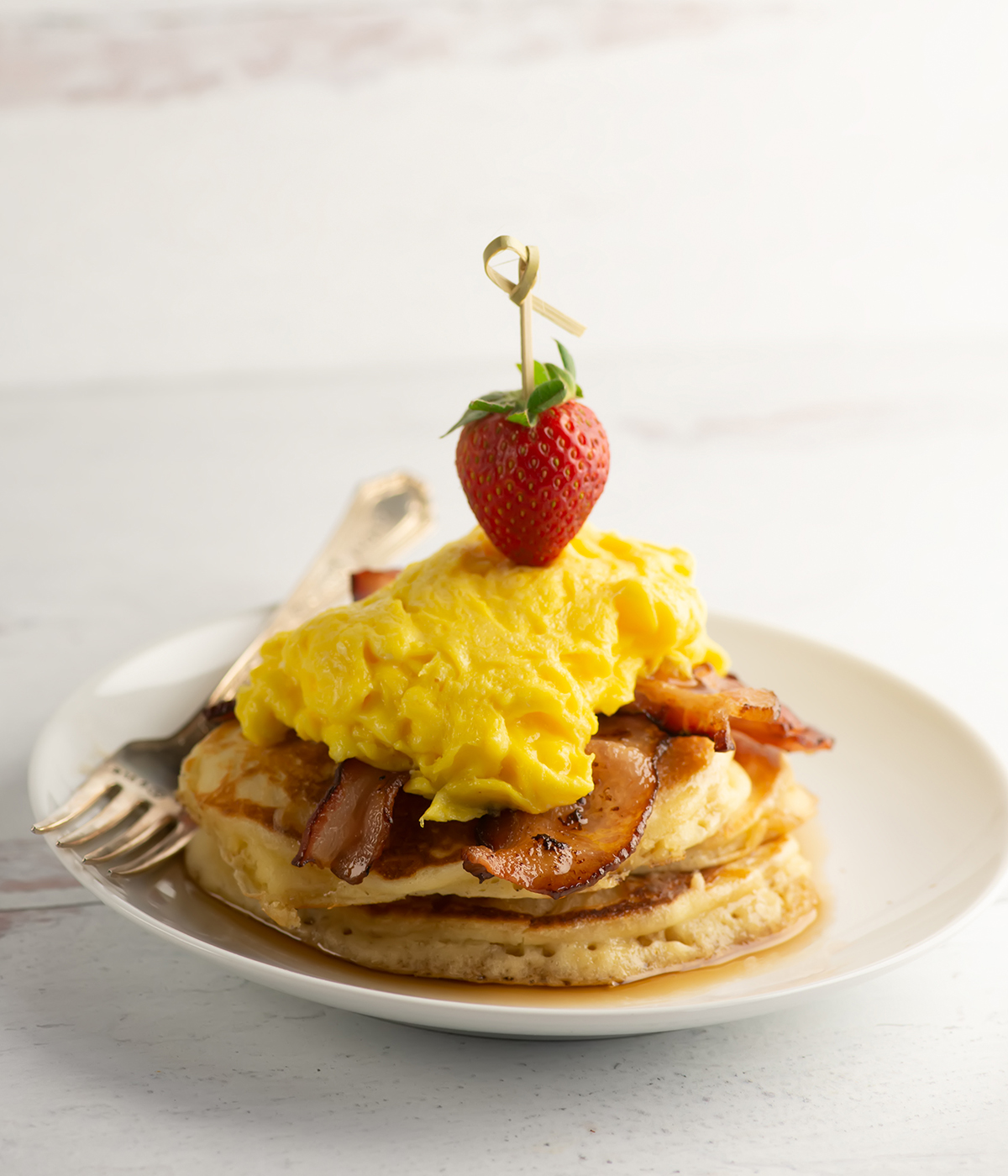 Stack of bacon and egg pancakes.