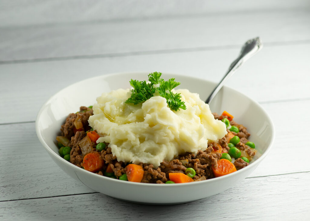 Skillet shepherd's pie in a bowl with a fork.