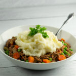 Skillet shepherd's pie in a bowl with a fork.