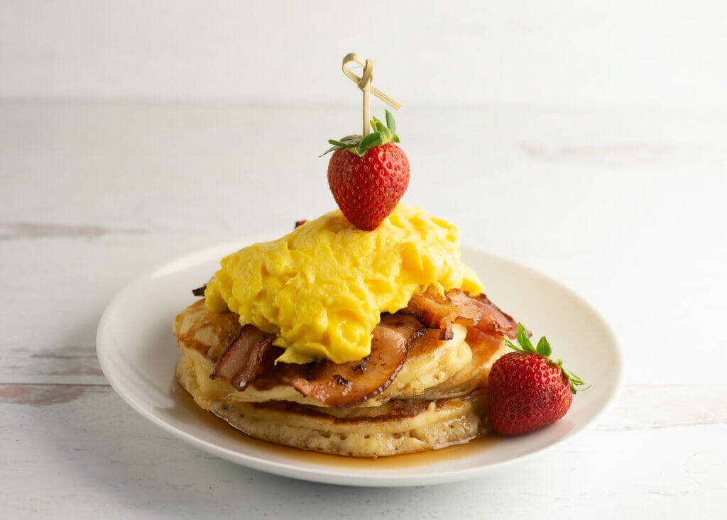 Bacon and egg pancakes on a plate.