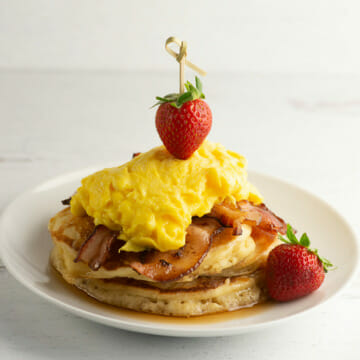 Bacon and egg pancakes on a plate.