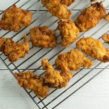 Buttermilk Fried Chicken Tenders cooling on a rack.