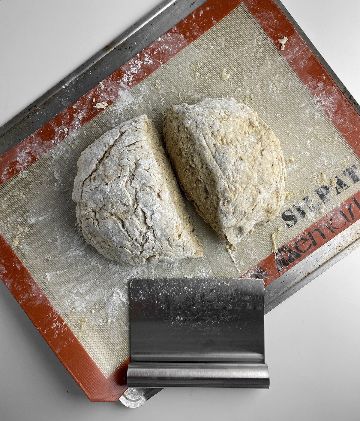 Irish brown bread dough cut in half.