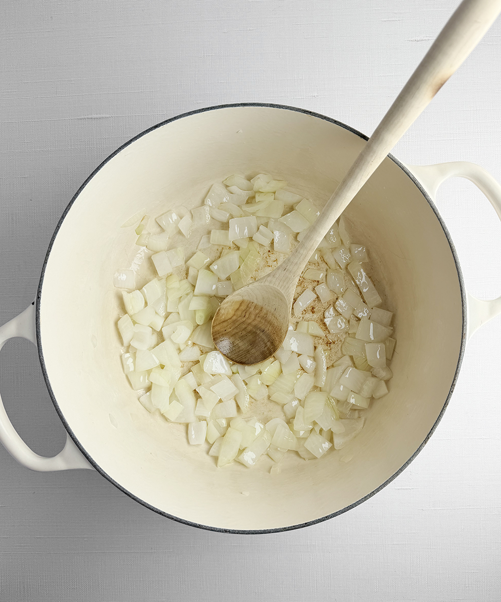 Onions cooking in a pot.