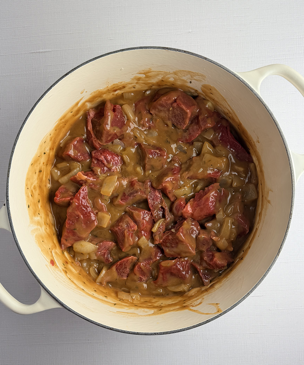 Pot of Guinness beef stew ingredients ready to be cooked.