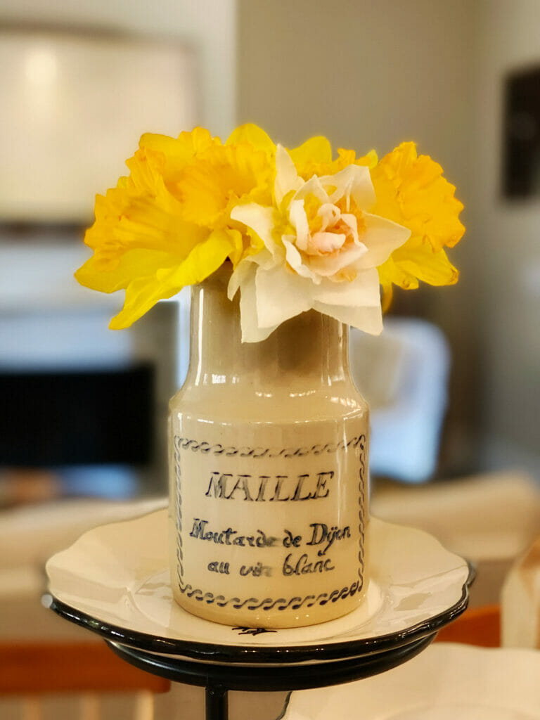 daffodils in mustard jar