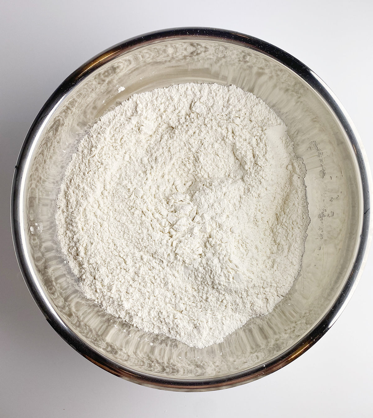 Focaccia flour salt mixture in a metal bowl.