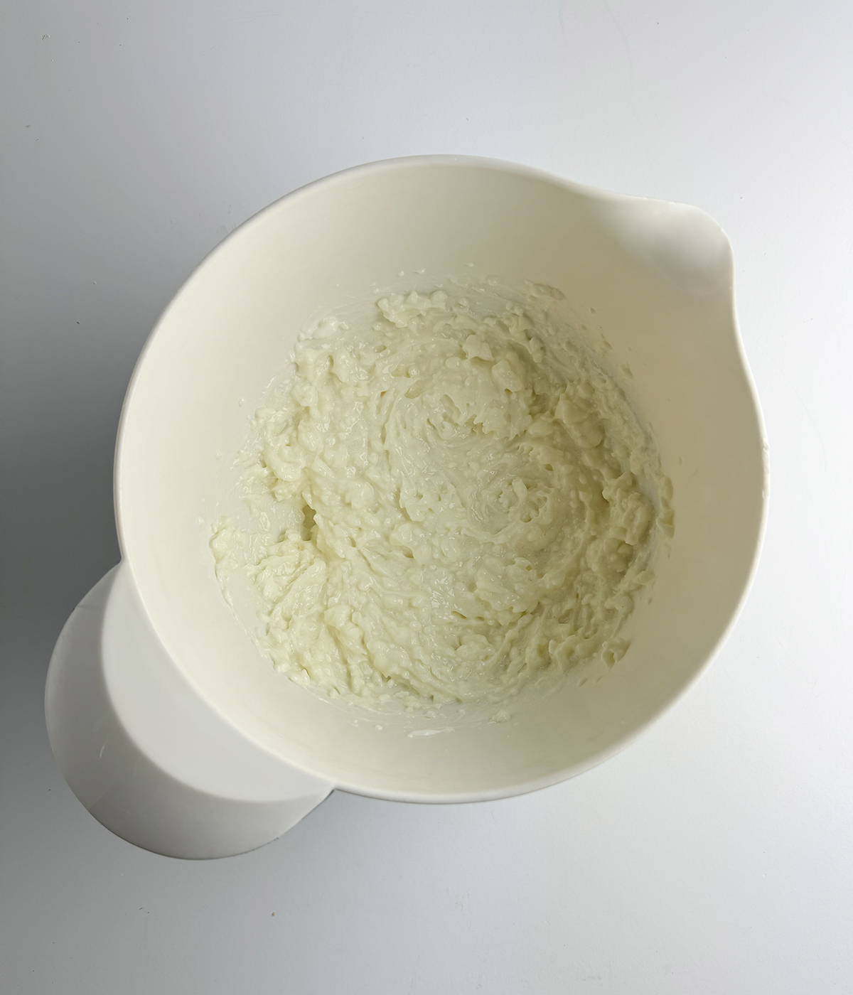 Cheesecake batter in a mixing bowl.