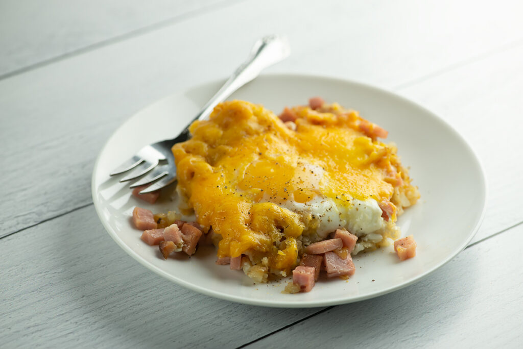 Ham and Egg Breakfast Casserole serving on a Plate with Fork.
