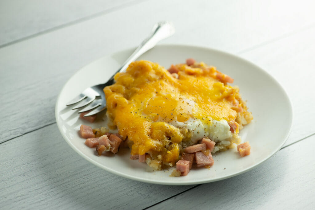 Ham and Egg Tater Tot Hash on White Plate with Fork