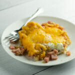 Ham and Egg Tater Tot Hash on White Plate with Fork.