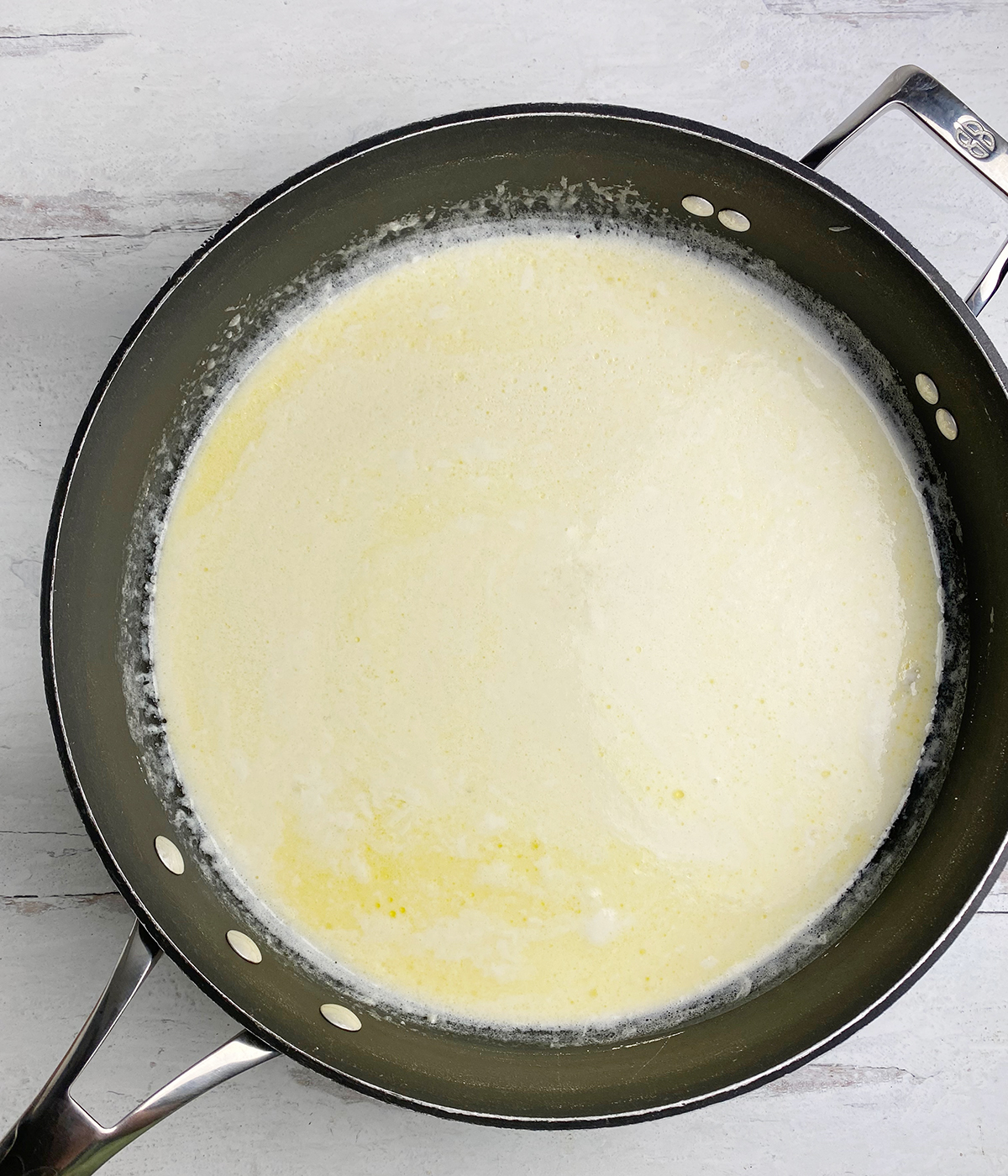 Alfredo Sauce in a skillet.