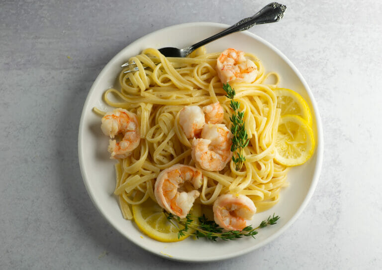 Lemon Shrimp Scampi Pasta on a plate with a fork.