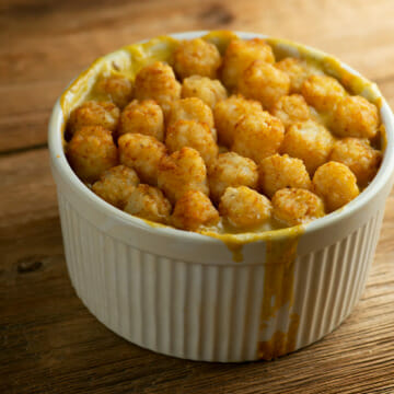 Tater tot shepherd's pie in bowl with spoon.