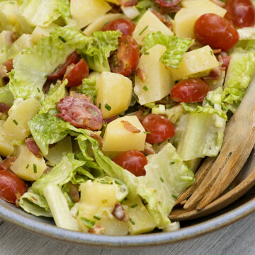 Bacon lettuce and tomato potato salad in a bowl.